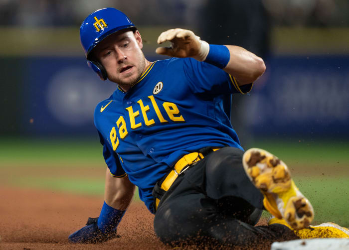 Sep 15, 2023; Seattle, Washington, USA; Seattle Mariners left fielder Jarred Kelenic (10) slides into third base against the Los Angeles Dodgers at T-Mobile Park. Mandatory Credit: Stephen Brashear-USA TODAY Sports